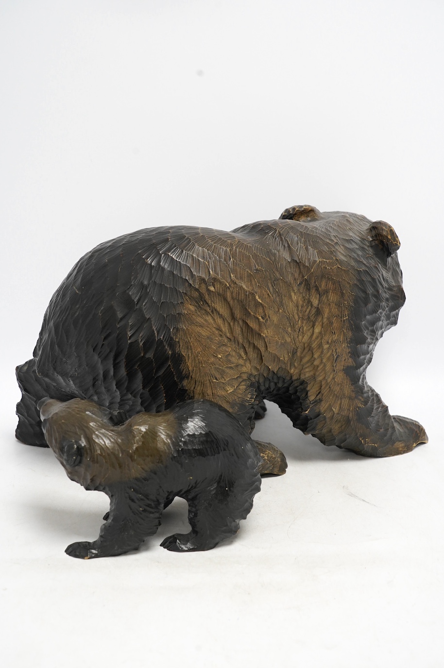 Two Japanese carved wood bears, largest approximately 38cm wide. Condition - poor, some damage